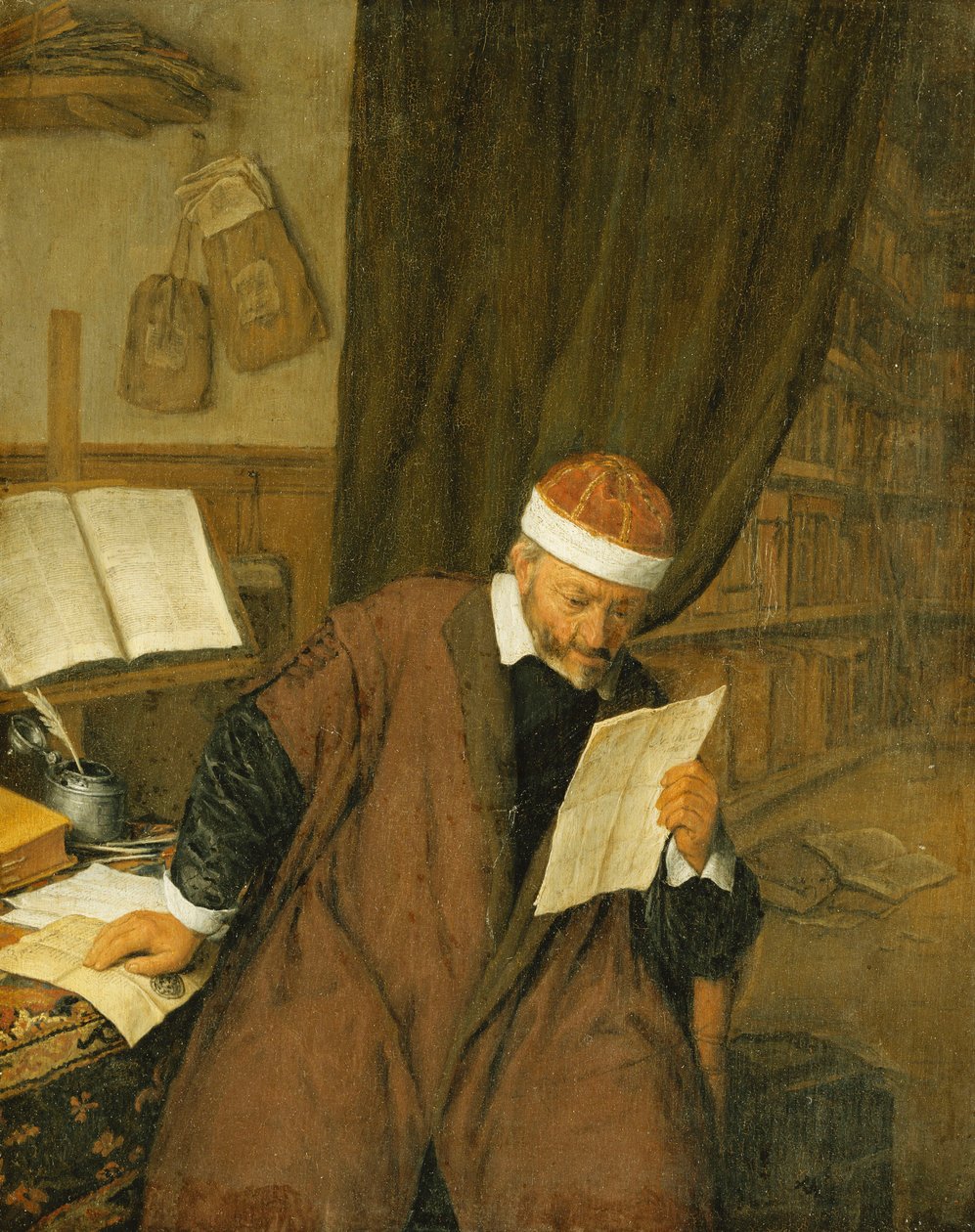 Un Avvocato Seduto a una Scrivania che Legge una Lettera, una Biblioteca sullo Sfondo, 1668 da Adriaen Jansz. van Ostade
