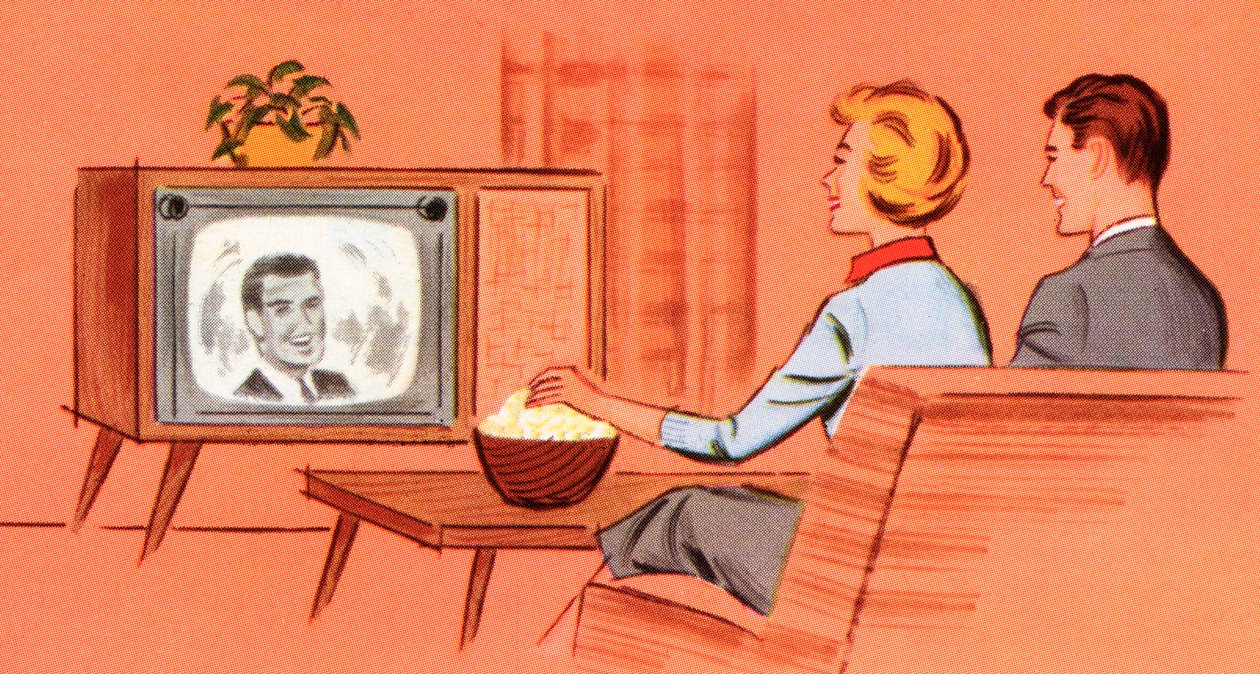 Una coppia che guarda un televisore retrò nella propria tana da American School