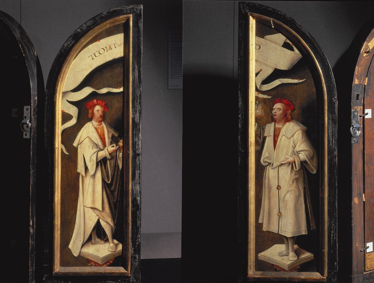 La purificazione di Naaman Trittico: pannelli laterali che raffigurano i martiri Cosma e Damiano, protettori contro la malattia, 1520 da Cornelis Engebrechtsz