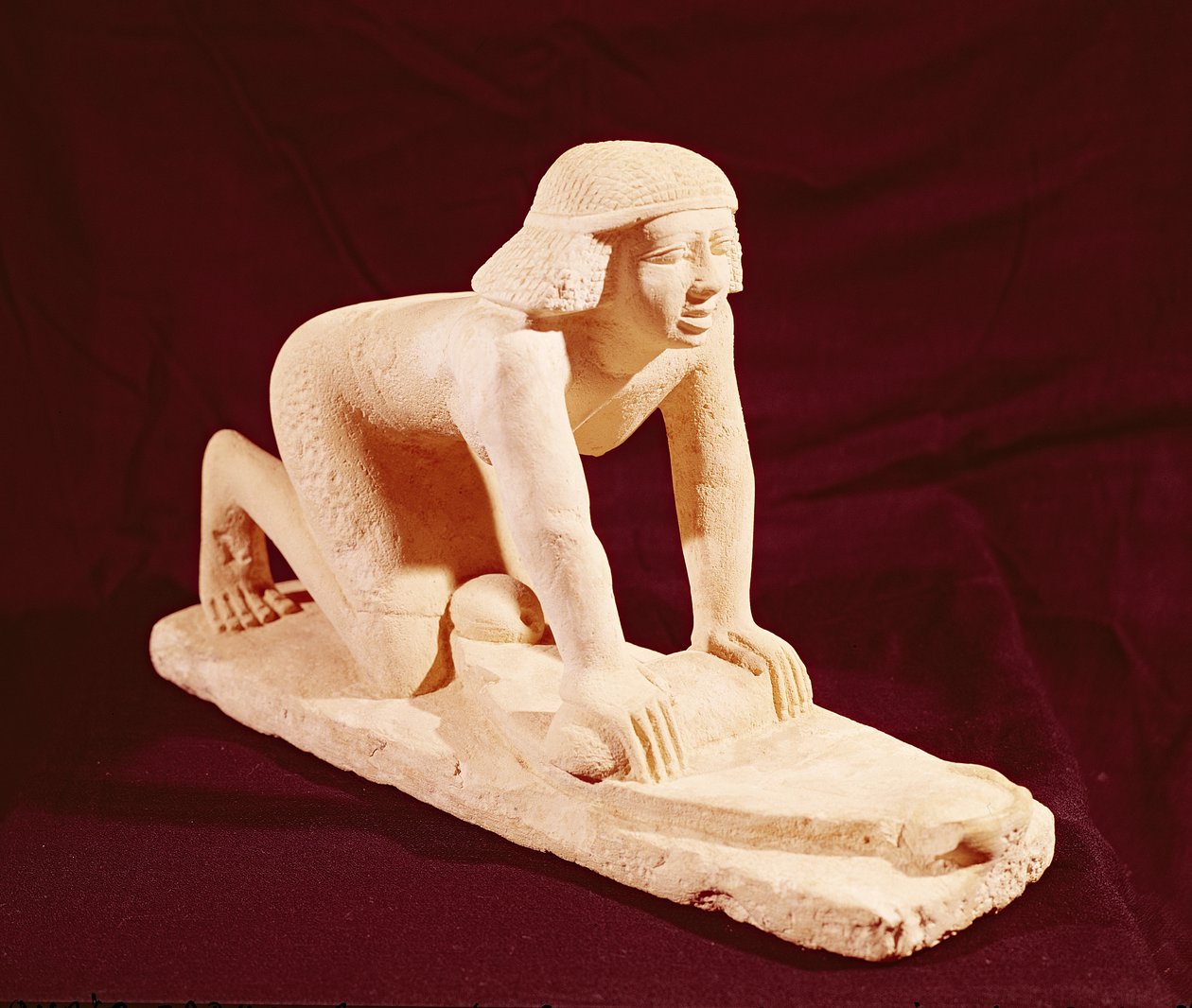 Modello di un servo che macina grano, Antico Regno, da Saqqara da Egyptian 5th Dynasty