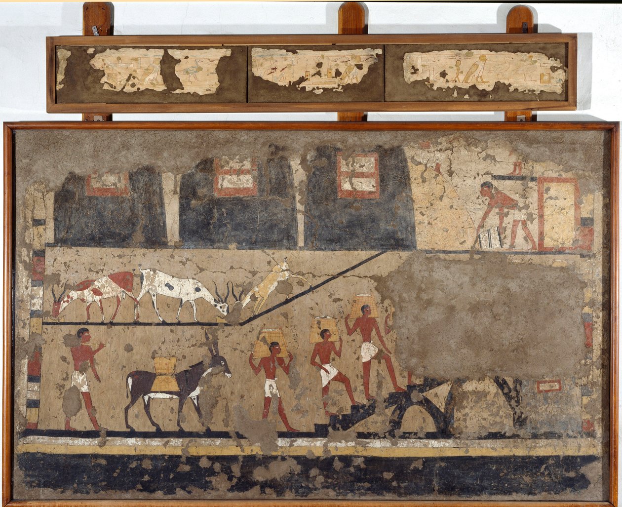Antichità egiziana: il trasporto del grano sul dorso dei muli e degli uomini. Detrempe su argilla e paglia dalla tomba del Generale e Cancelliere del Re Iti a El Ghebelen vicino a Luxor. 2200-2000 a.C. Torino, Museo Egizio da Egyptian Egyptian