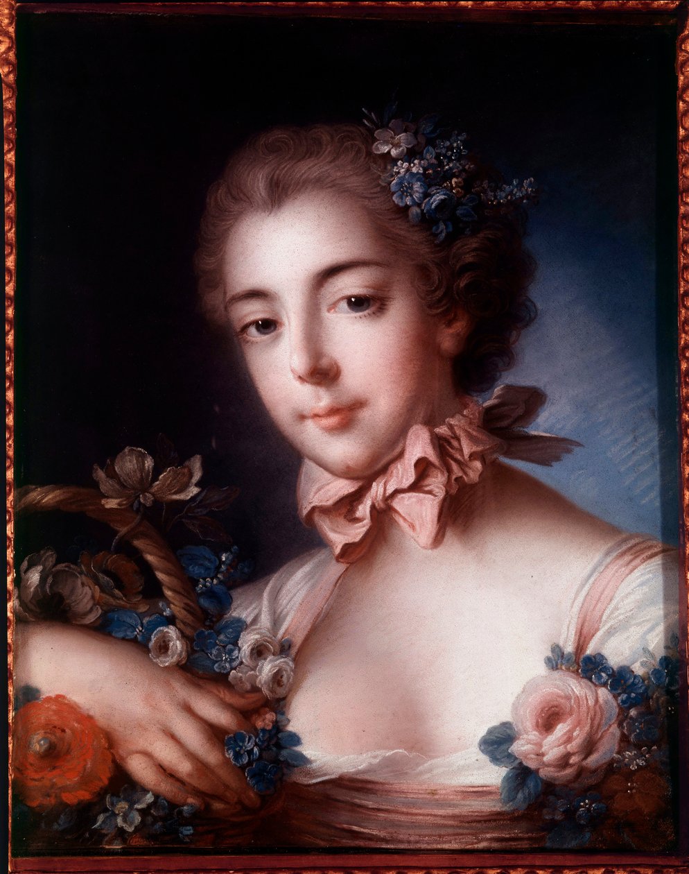 Ritratto di una giovane donna appoggiata a un cesto di fiori da François Boucher