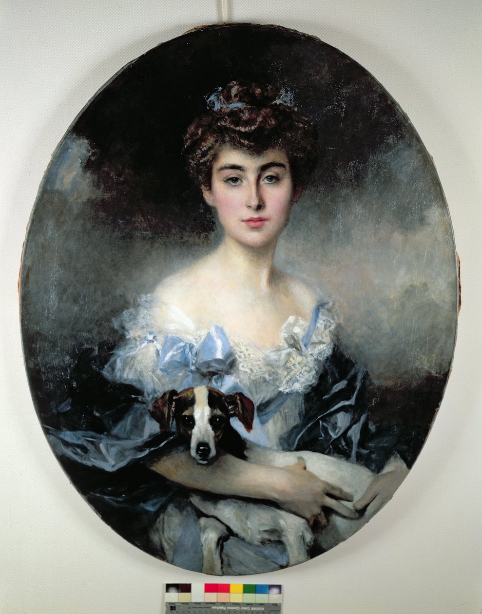 Giovane donna con un cane da Francois Flameng