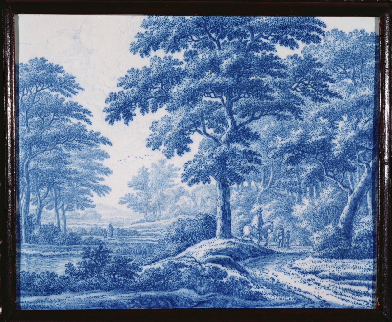 Una placca rettangolare blu e bianca di Delft olandese molto rara, raffigurante viandanti su una strada in un paesaggio boscoso da Frederik van Frijtom