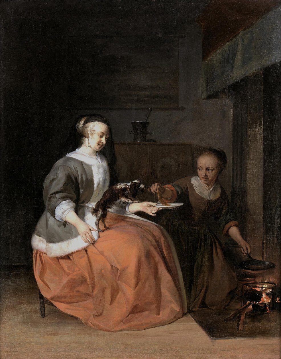Giovane donna e serva che danno da mangiare una frittella a un cane da Gabriel Metsu