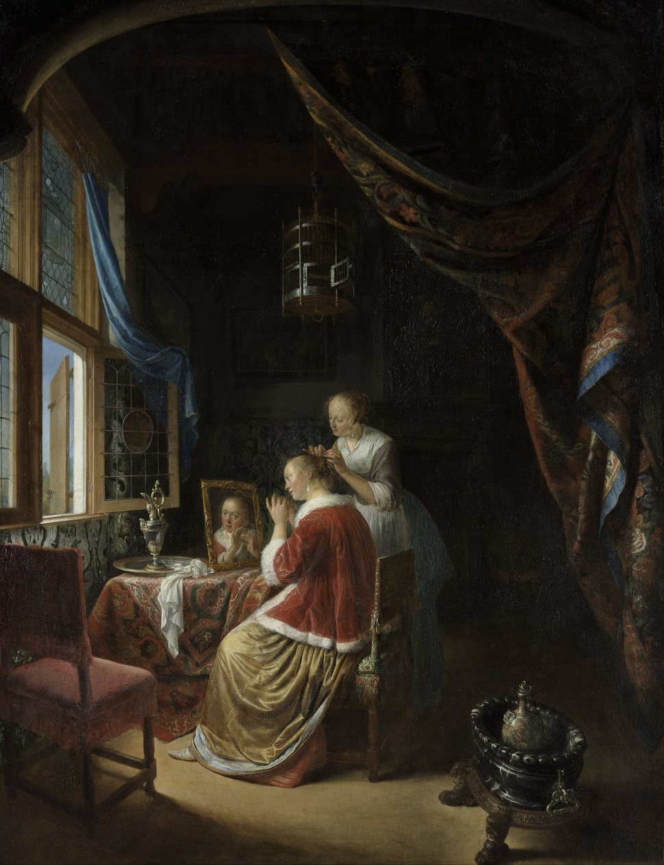 Giovane donna alla toilette da Gerrit Dou