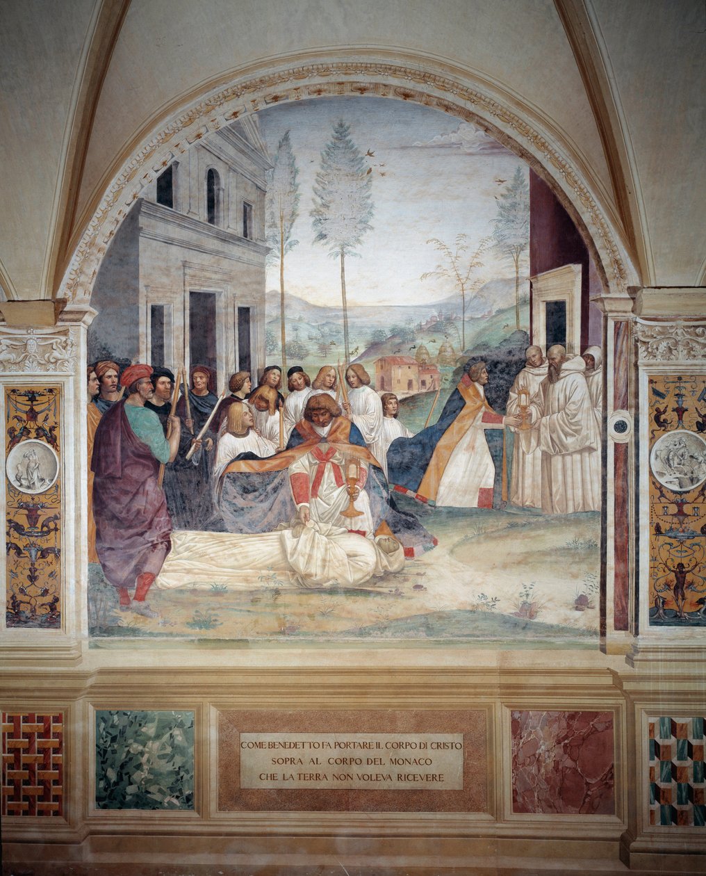 San Benedetto porta il corpo di Cristo sul corpo del monaco che la terra rifiuta di seppellire affresco del chiostro realizzato da Antonio Bazzi detto il Sodoma (1477 - 1549) che racconta la vita di San Benedetto da Norcia (480 - 567) fondatore dell
