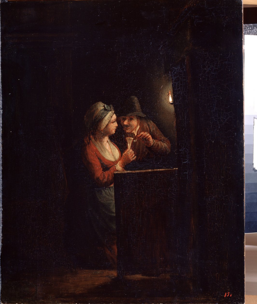 Un uomo e una donna alla luce di una candela da Godfried Schalcken