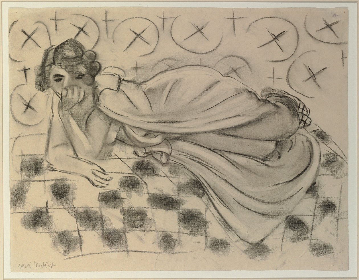 Figura drappeggiata sdraiata su un divano a scacchi nero da Henri Matisse