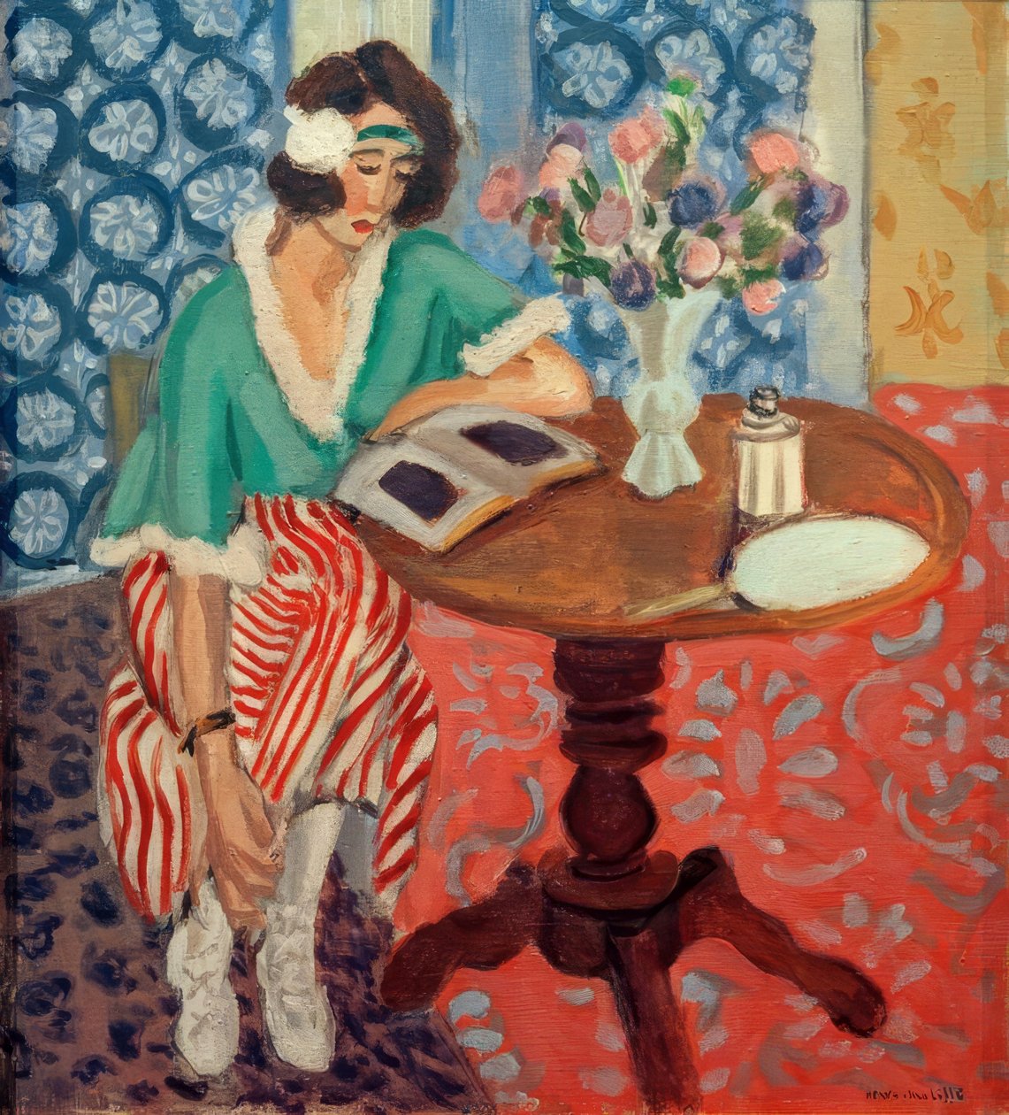 Donna che legge a un tavolo ((in abito a righe verdi e rosse)) da Henri Matisse