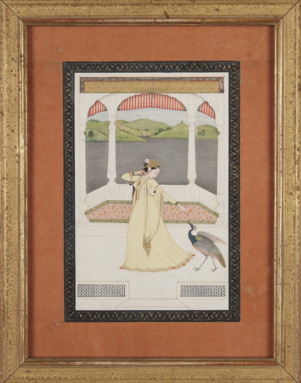 Signora che attira un pavone con una collana di perle, c.1800 da Indian School