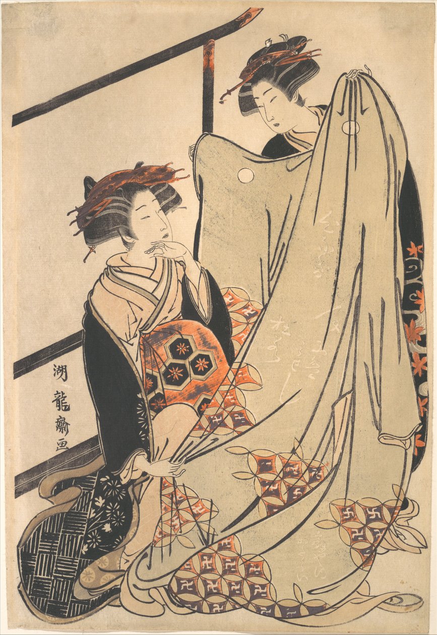 Due bellezze che guardano un kimono da Isoda Koryusai
