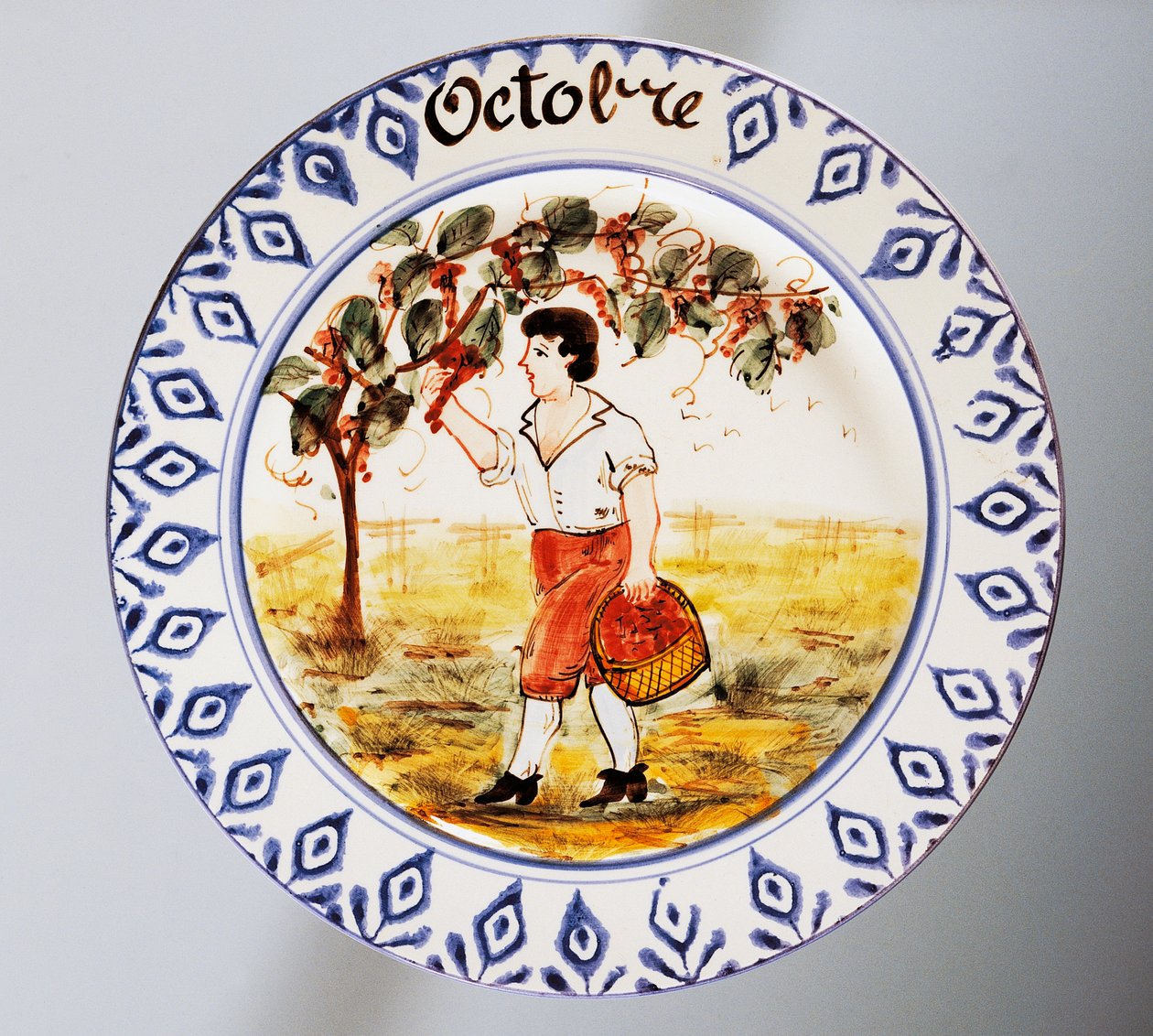 Piatto raffigurante mesi, ottobre, terracotta, manifattura Nove di Bassano, Veneto, Italia, XX secolo. da Italian School