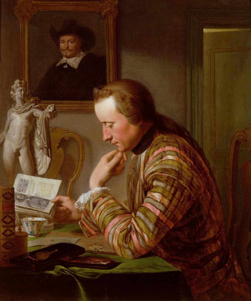 Gentiluomo che legge a un tavolo alla luce di una candela da Jan Maurits Quinckhardt