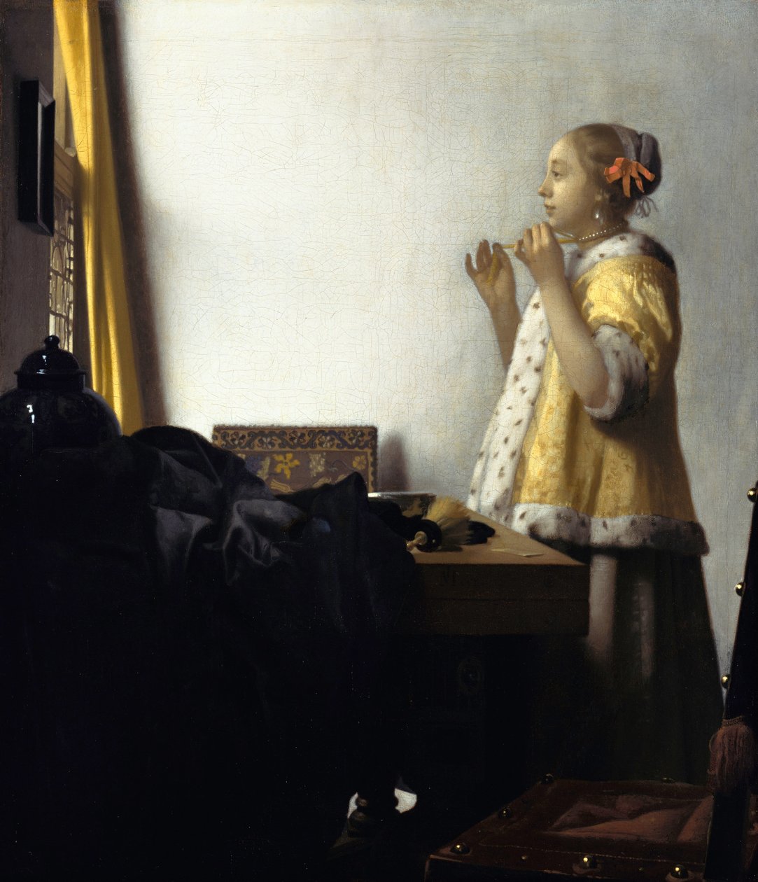 Giovane donna con una collana di perle da Jan Vermeer van Delft