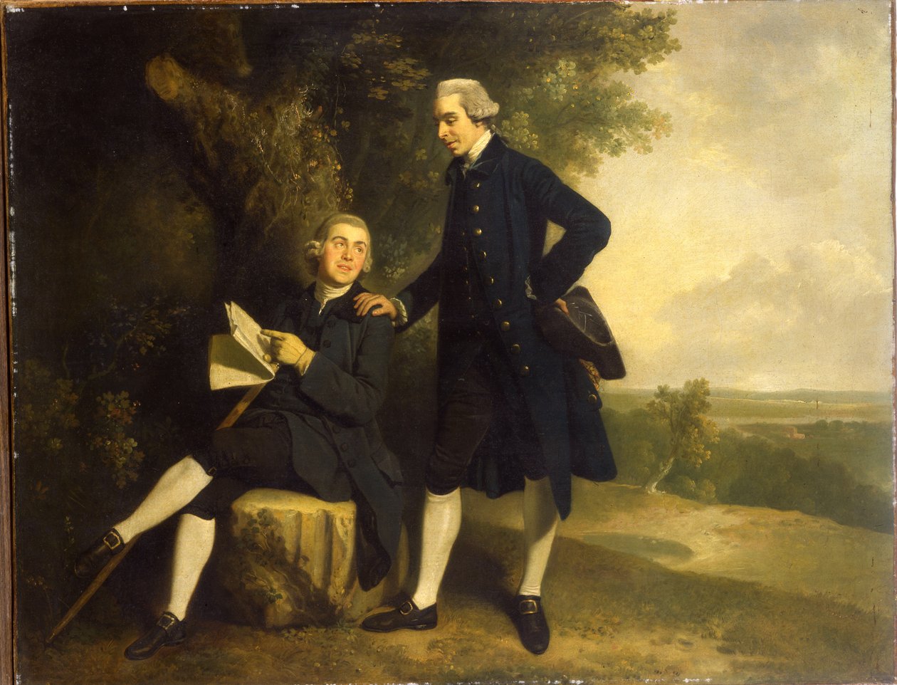 Doppio ritratto di Thomas Somers Cocks e Richard Cocks di Castleditch, entrambi a figura intera, il primo in un cappotto e gilet blu che tiene un tricorno nero, il secondo seduto in un cappotto e gilet blu che tiene un manoscritto, in un paesaggio da John Hamilton Mortimer