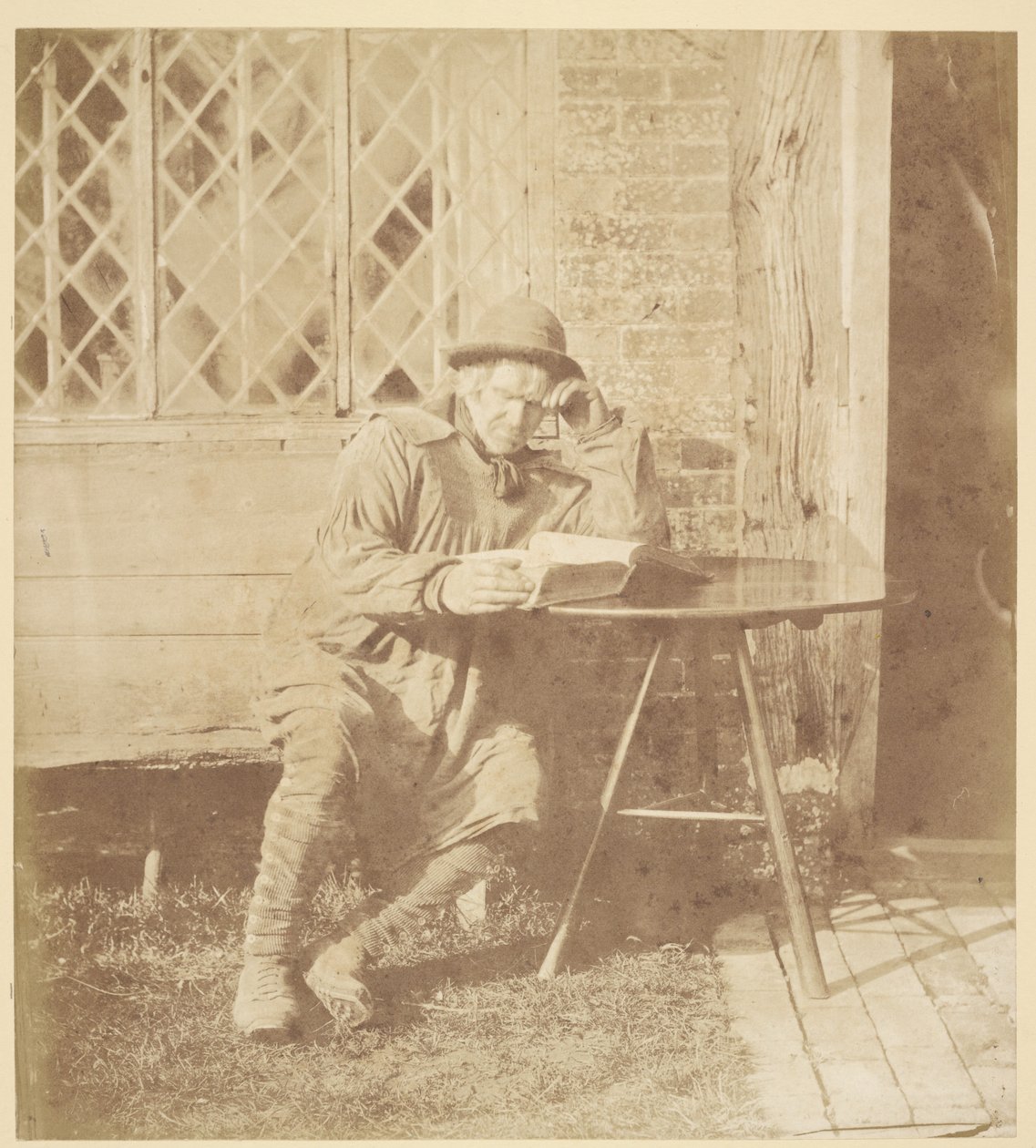 [Uomo che legge un libro] da John Whistler
