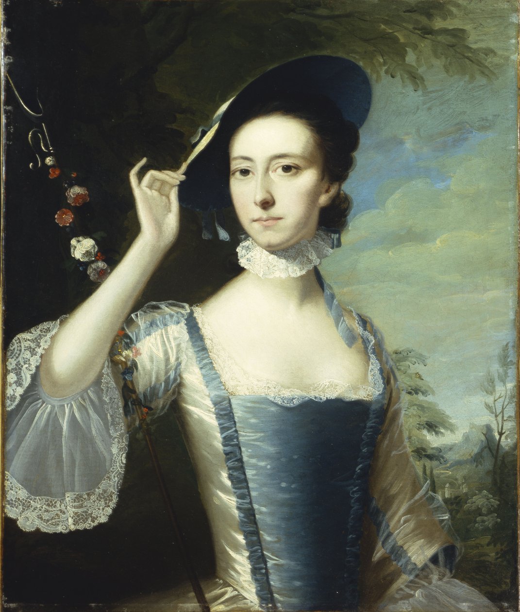 Ritratto di una signora accanto a una ghirlanda di fiori, in un paesaggio da Joseph Wright of Derby