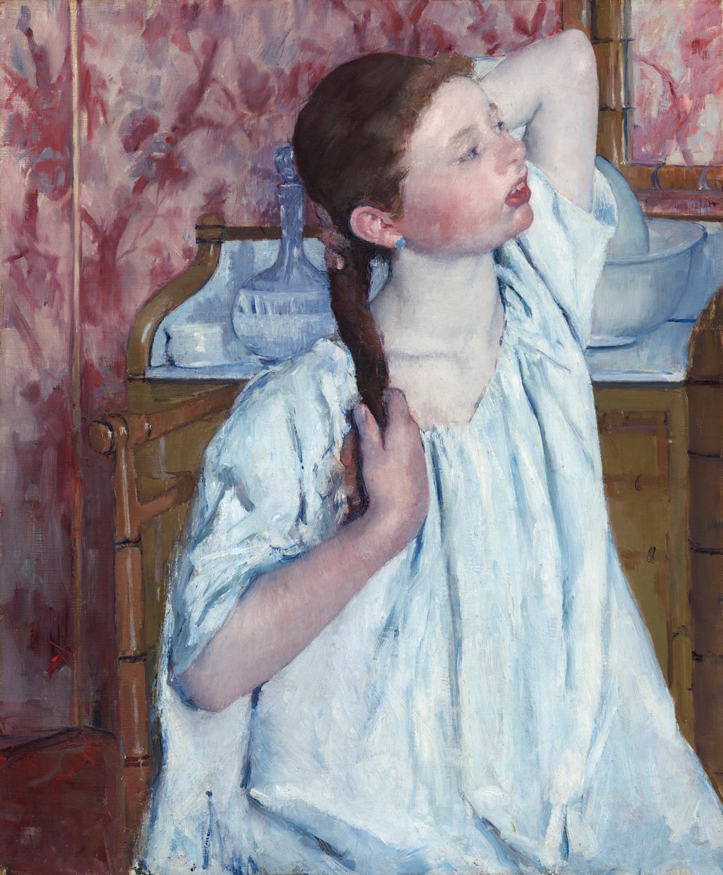 Ragazza che si sistema i capelli da Mary Cassatt
