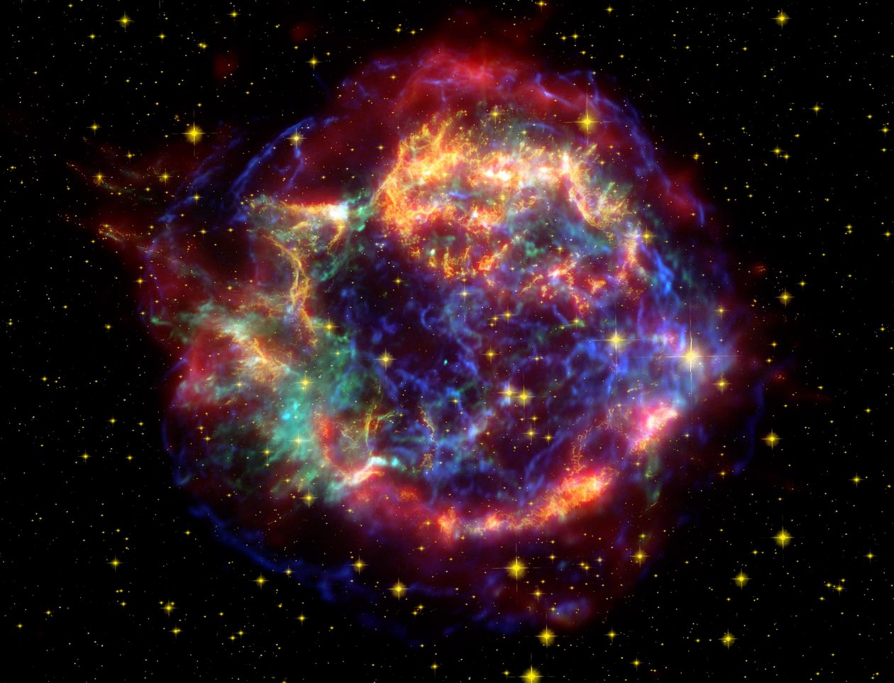 Immagine a falsi colori del resto di supernova Cassiopeia A nella costellazione Cassiopeia, a 10.000 anni luce di distanza. È il resto di una stella una volta massiccia che è morta in un