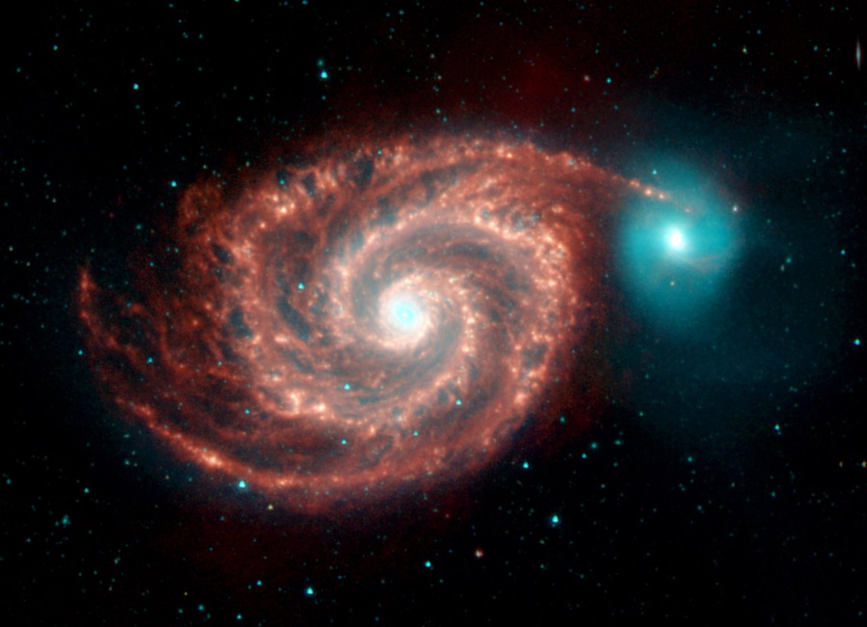 Immagine a infrarossi del telescopio spaziale Spitzer della galassia Whirlpool. Strutture strane colmano i vuoti tra i bracci a spirale ricchi di polvere e mostrano la polvere, il gas e le popolazioni stellari nella luminosa galassia a spirale. Credito NAS da National Aeronautics and Space Administration National Aeronautics and Space Administration