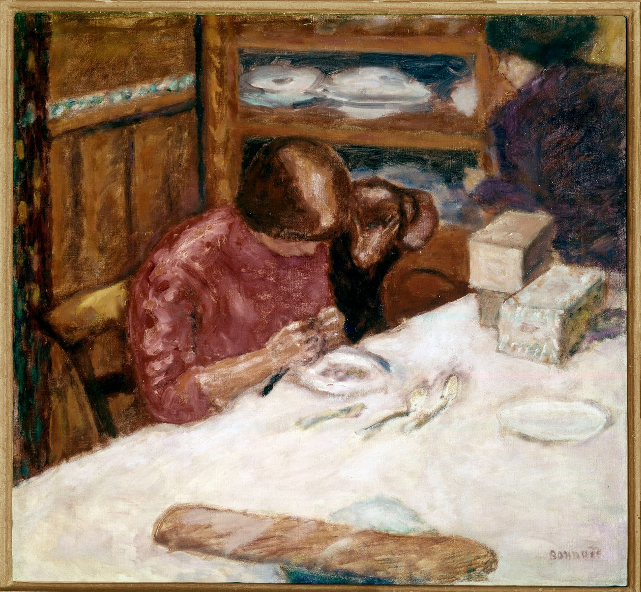 Interno, donna impegnata in faccende domestiche da Pierre Bonnard
