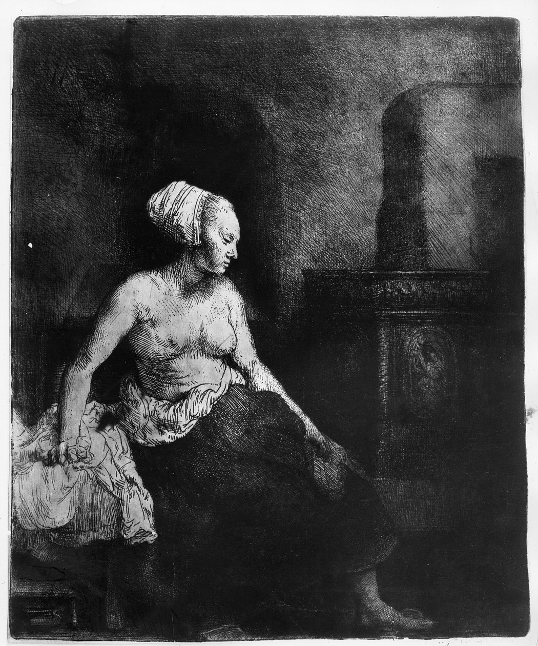 Donna seduta mezza vestita accanto a una stufa, 1658 da Rembrandt van Rijn