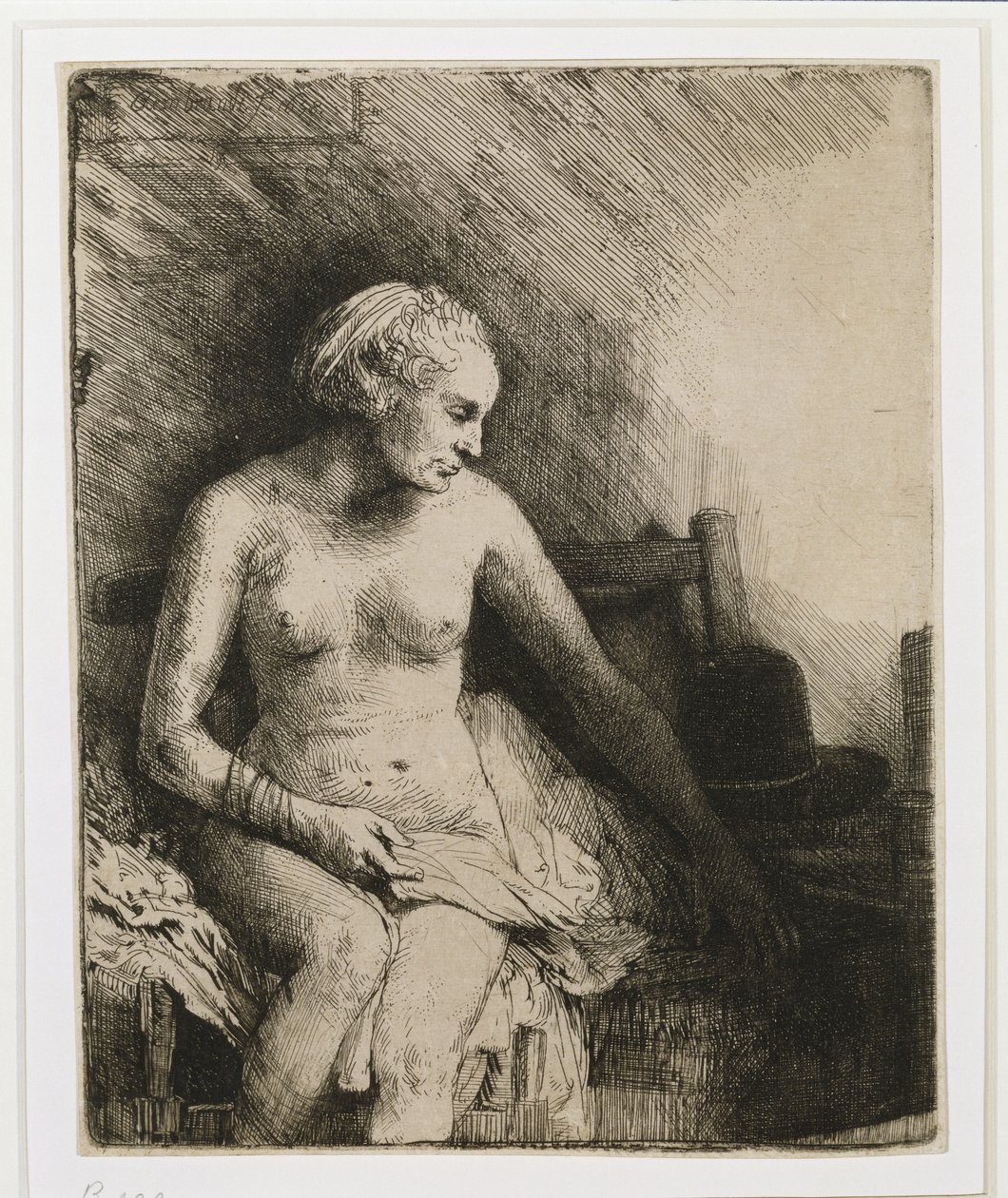 Una donna al bagno con un cappello accanto, 1658 da Rembrandt van Rijn