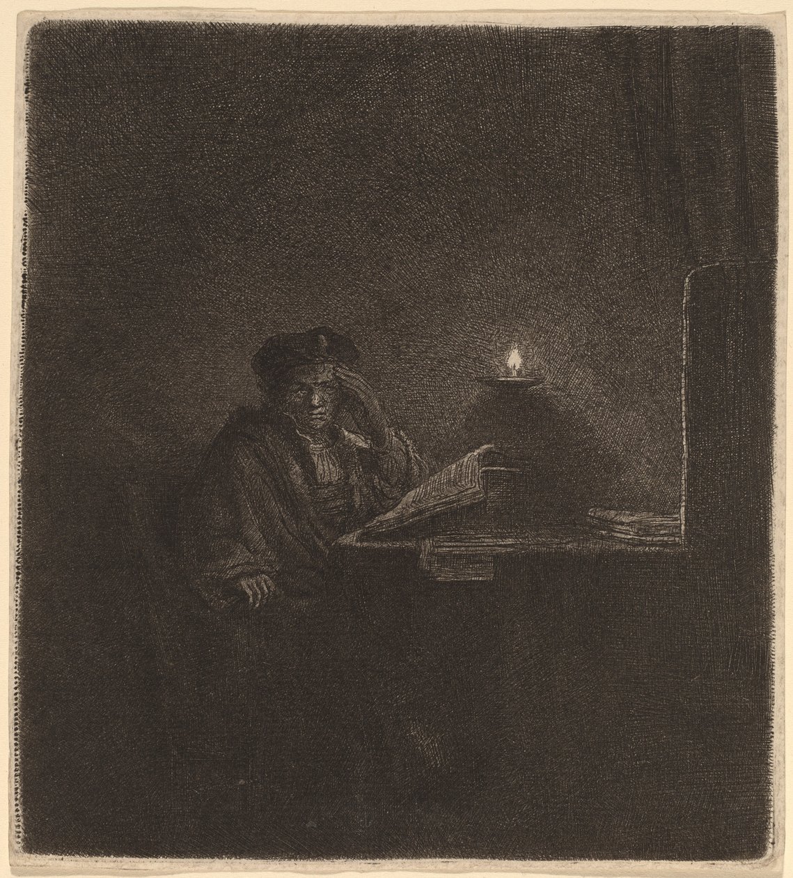 Studente a un tavolo alla luce di una candela da Rembrandt van Rijn