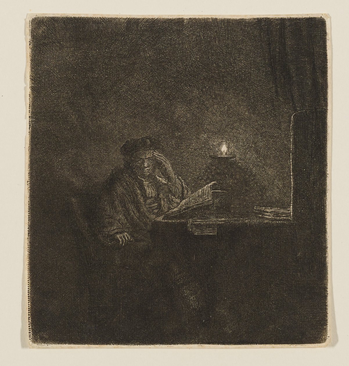 Uno studente seduto a un tavolo alla luce di una candela da Rembrandt van Rijn