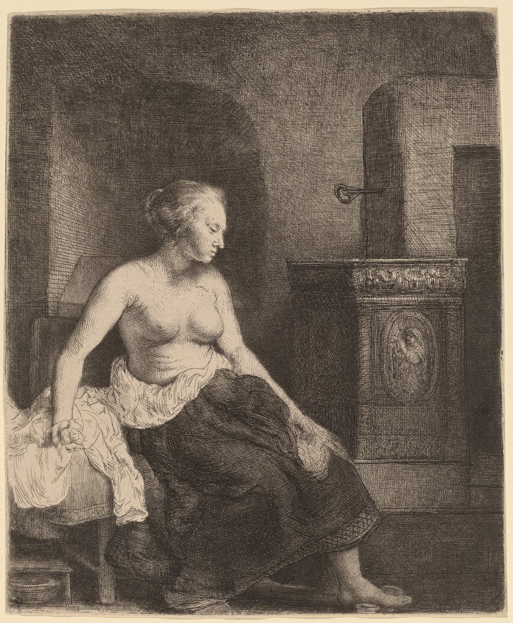 Donna seduta mezza vestita accanto a una stufa da Rembrandt van Rijn