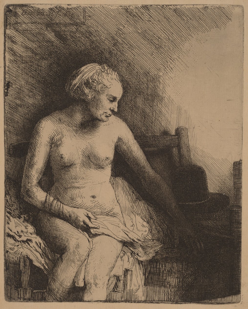 Donna nella vasca da bagno con un cappello accanto a sé da Rembrandt van Rijn