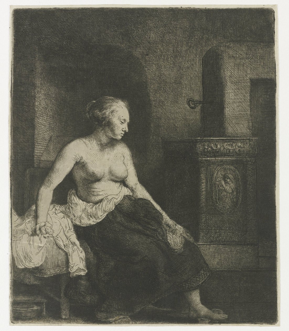 Donna seduta mezza vestita accanto a una stufa da Rembrandt van Rijn