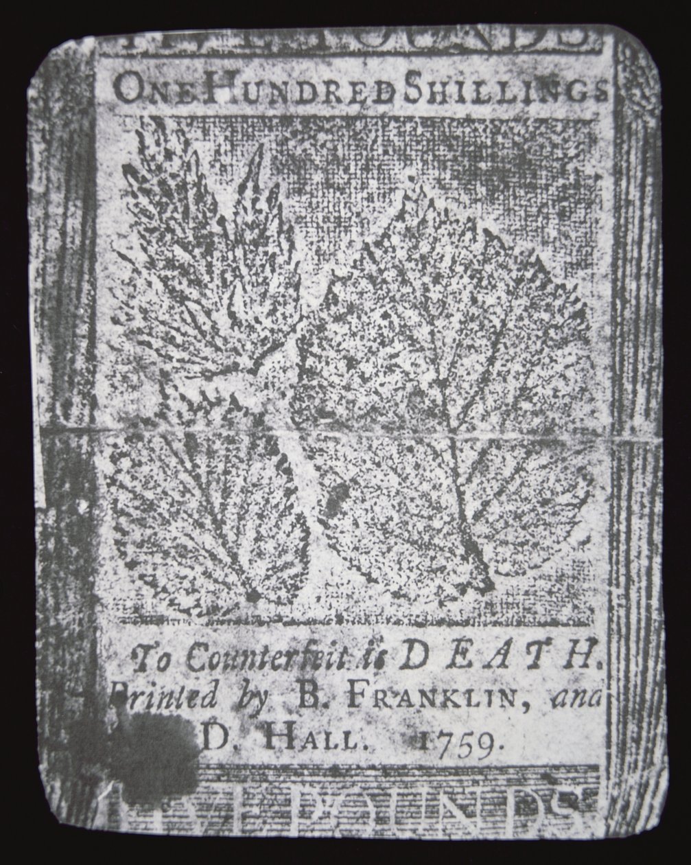 Una banconota da 100 scellini progettata e stampata da Benjamin Franklin nel 1759 da School American