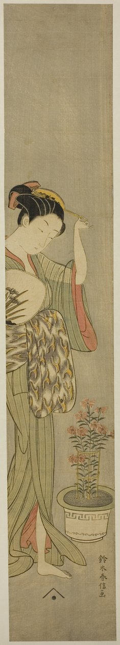 Bellezza che aggiusta il fermaglio per capelli da Suzuki Harunobu