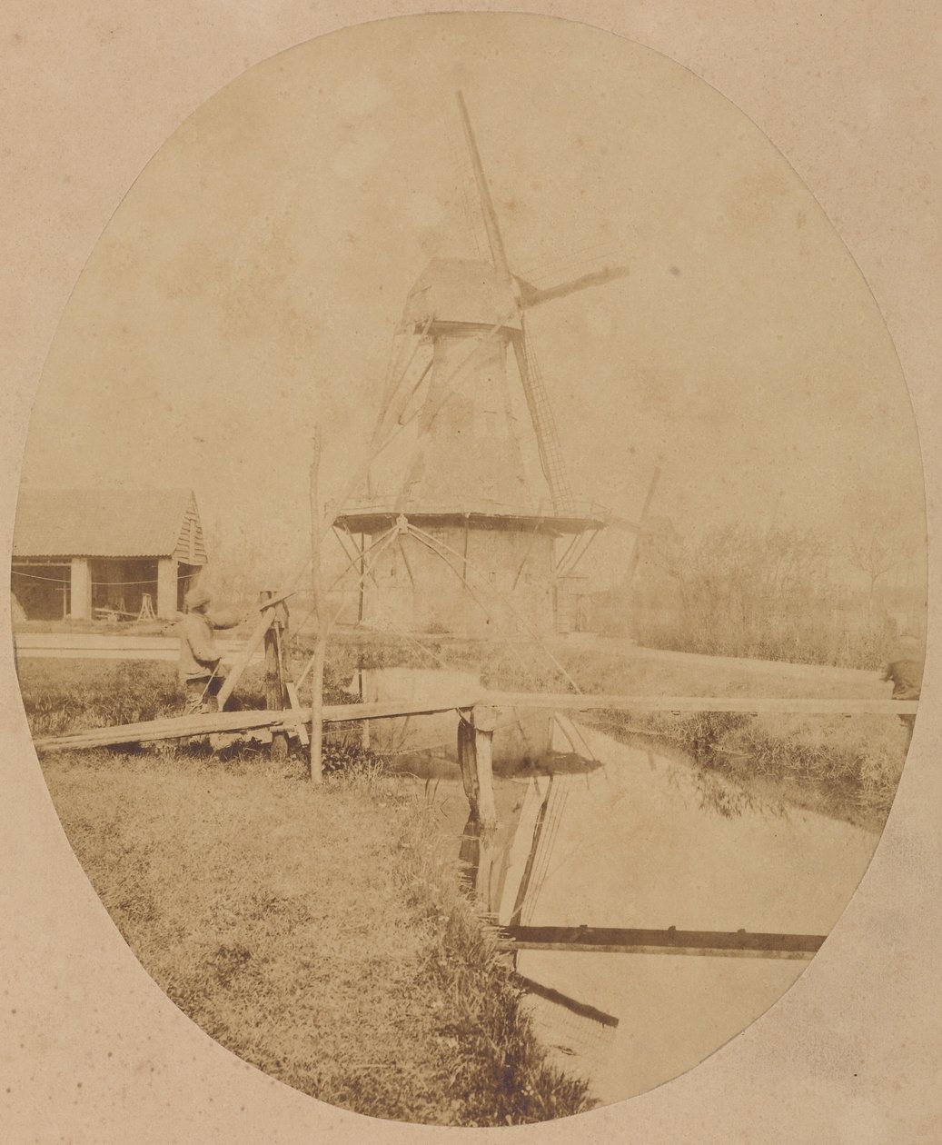 [Pittore con il cappello al cavalletto che dipinge un mulino a vento]. da Unknown artist
