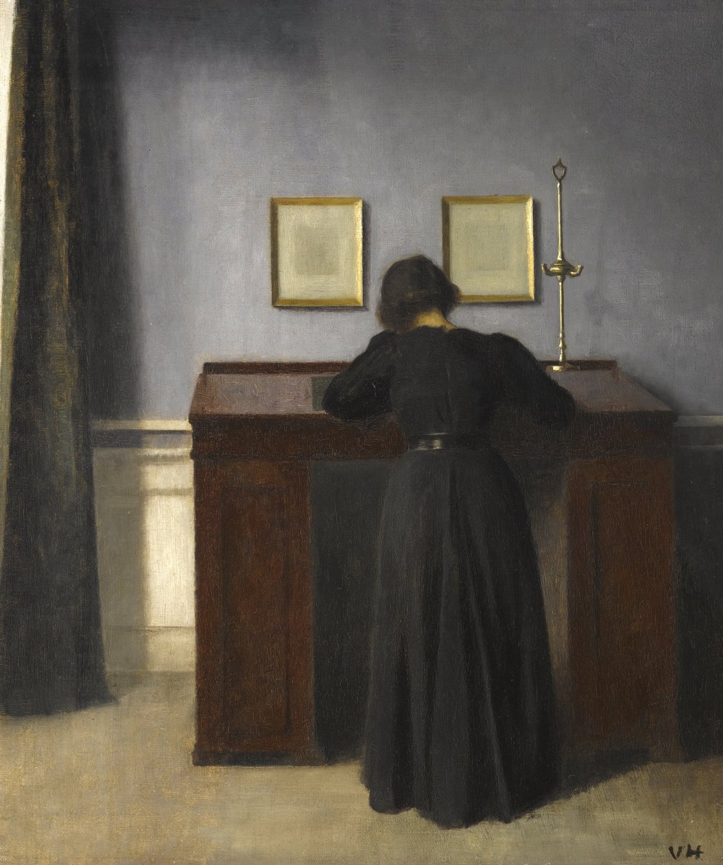 Ida in piedi a una scrivania, 1900 da Vilhelm Hammershoi
