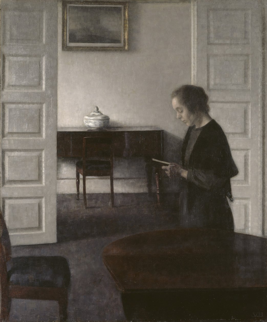 Interno con una signora che legge da Vilhelm Hammershoi