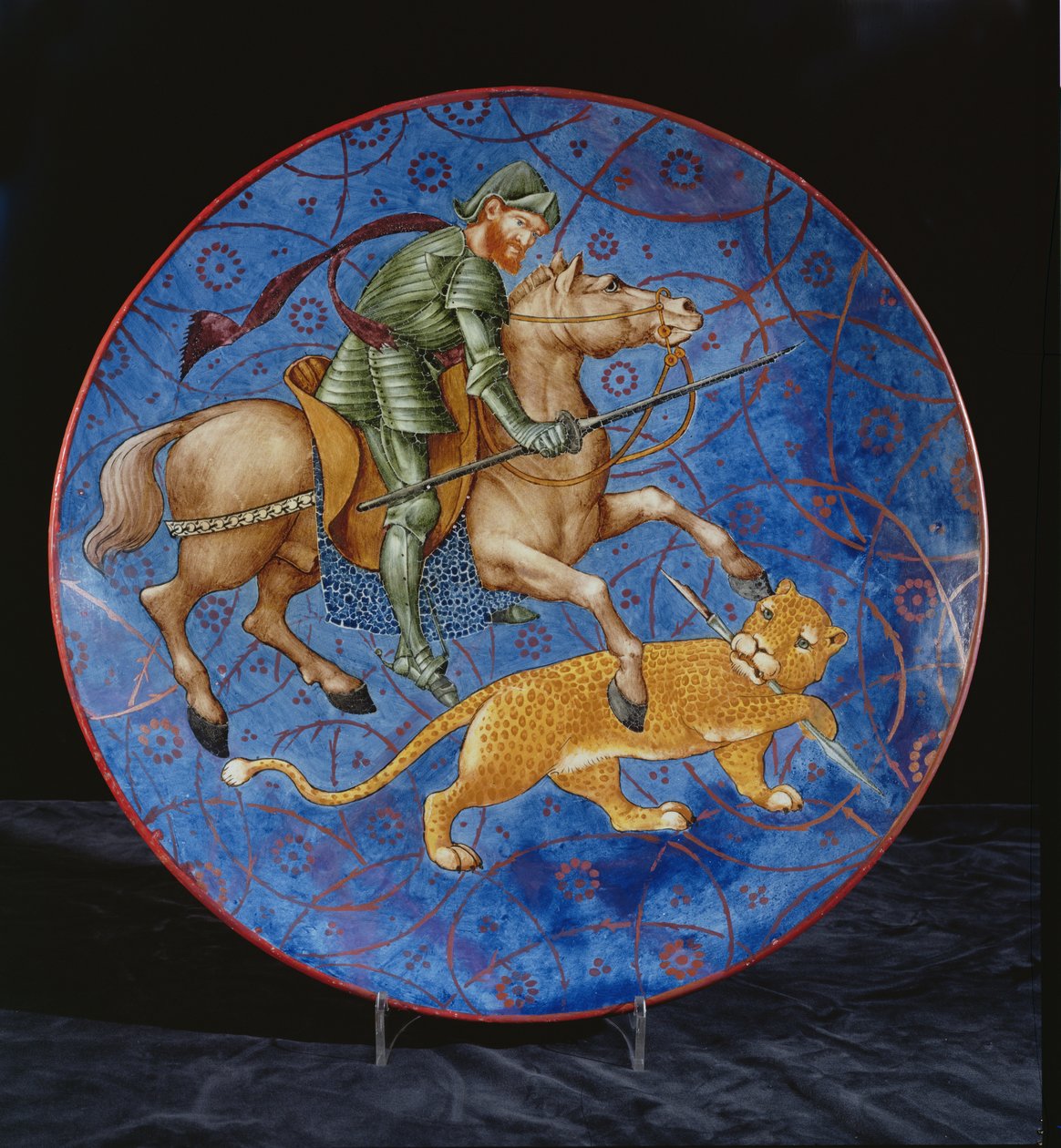 Piatto con un cavaliere montato che tenta di infilzare un leopardo da William de Morgan