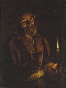 Vecchio che tiene una candela e un bicchiere