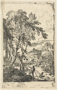 Paesaggio montuoso con alberi e uomo con cane
