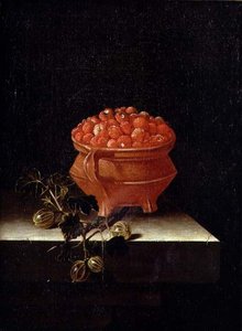 Fragole e uva spina su un ripiano di pietra