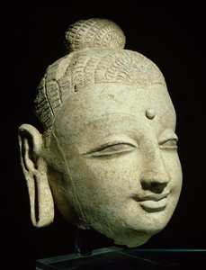 Testa di un Buddha sorridente, stile greco-buddhista, dall
