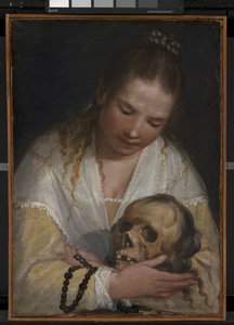 Una giovane donna che contempla un teschio
