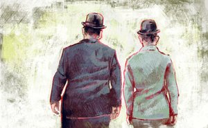 Stan Laurel e Oliver Hardy che marciano verso l