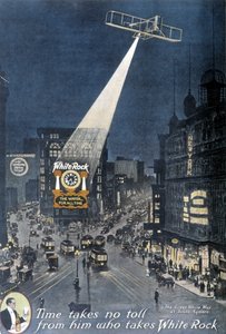 Pubblicità di alcolici "White Rock": Un aereo illumina il poster "White Rock" appeso su un edificio a Times Square a New York. 1912. da American School