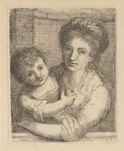 Mamma che tiene in braccio un bambino con una mela