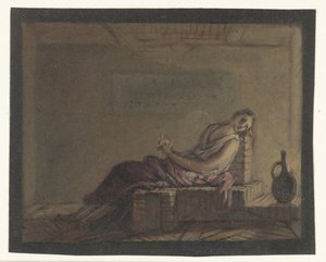 Donna seduta sul letto in una cella