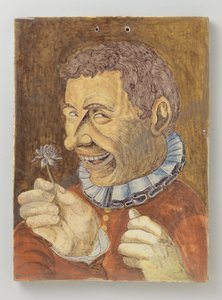 Placca di faience con uomo con fiore