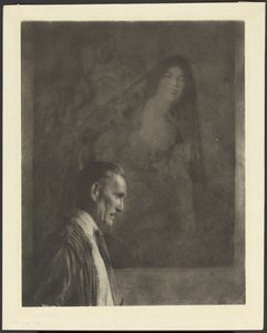 [Uomo con baffi piccoli e ordinati di profilo in posa davanti a un dipinto di donna in costume spagnolo].